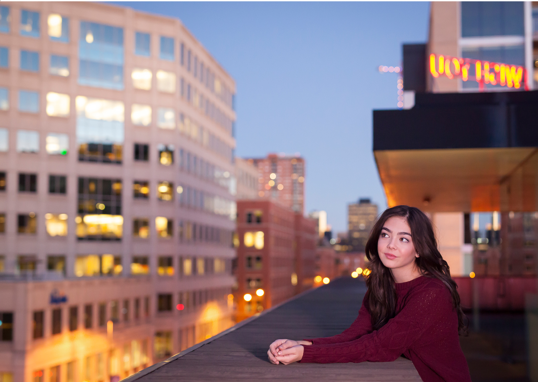 Urban rooftop high school senior pictures with twinkling lights at twilight with photographer Jennifer Koskinen, Merritt Portrait Studio