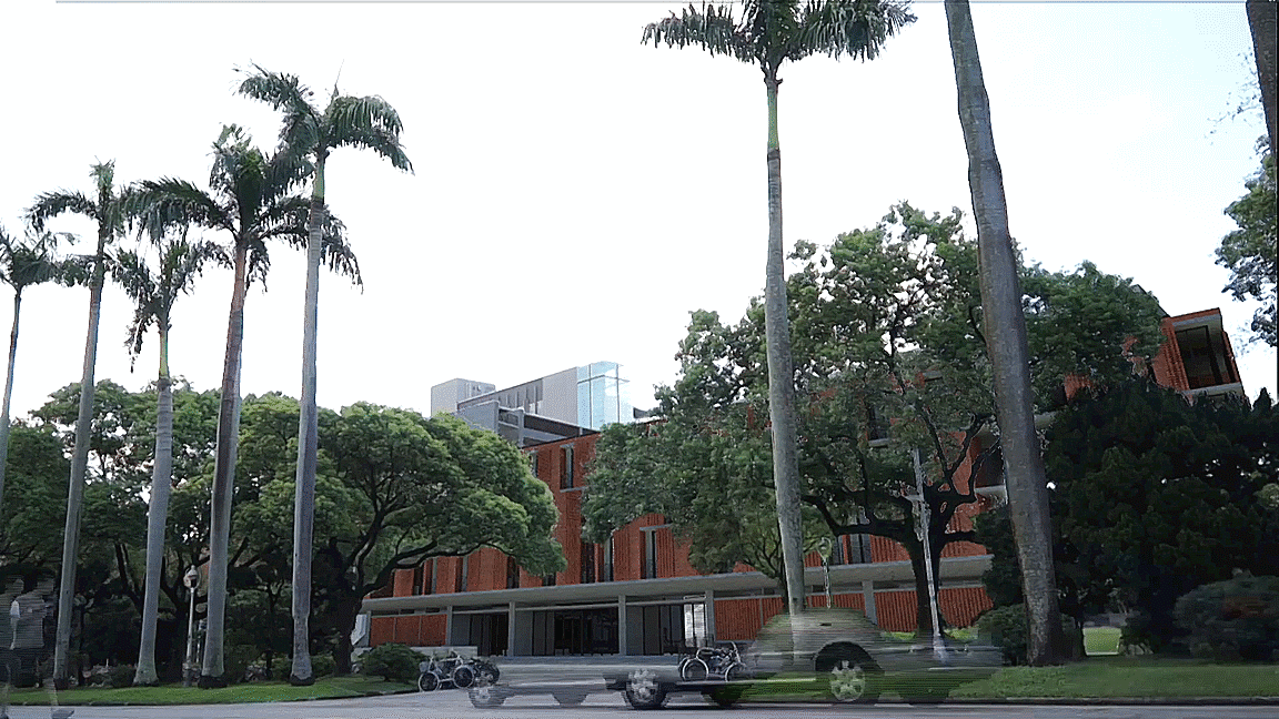 人文館在椰林大道上的風貌，紅磚立面延續了椰林大道建築群的立面語彙。