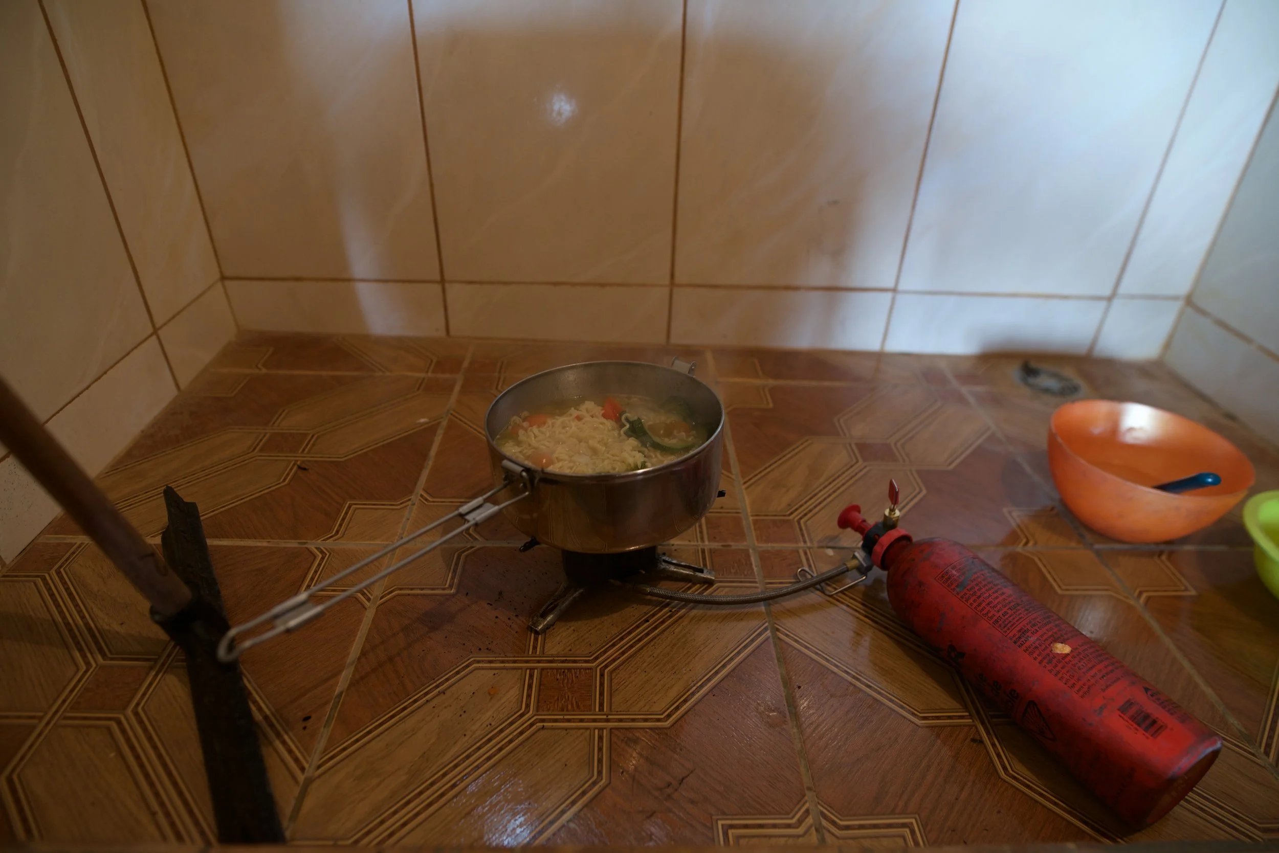 Cooking in the shower in Bolivia. I used a XGK EX stove from MSR for a decade without a single issue: Literally the best prepper/overlander stove on the market. I used all kinds of fuel. Never costed me more than a dollar a week to cook as much as I want. The best $200CAD ever spent.