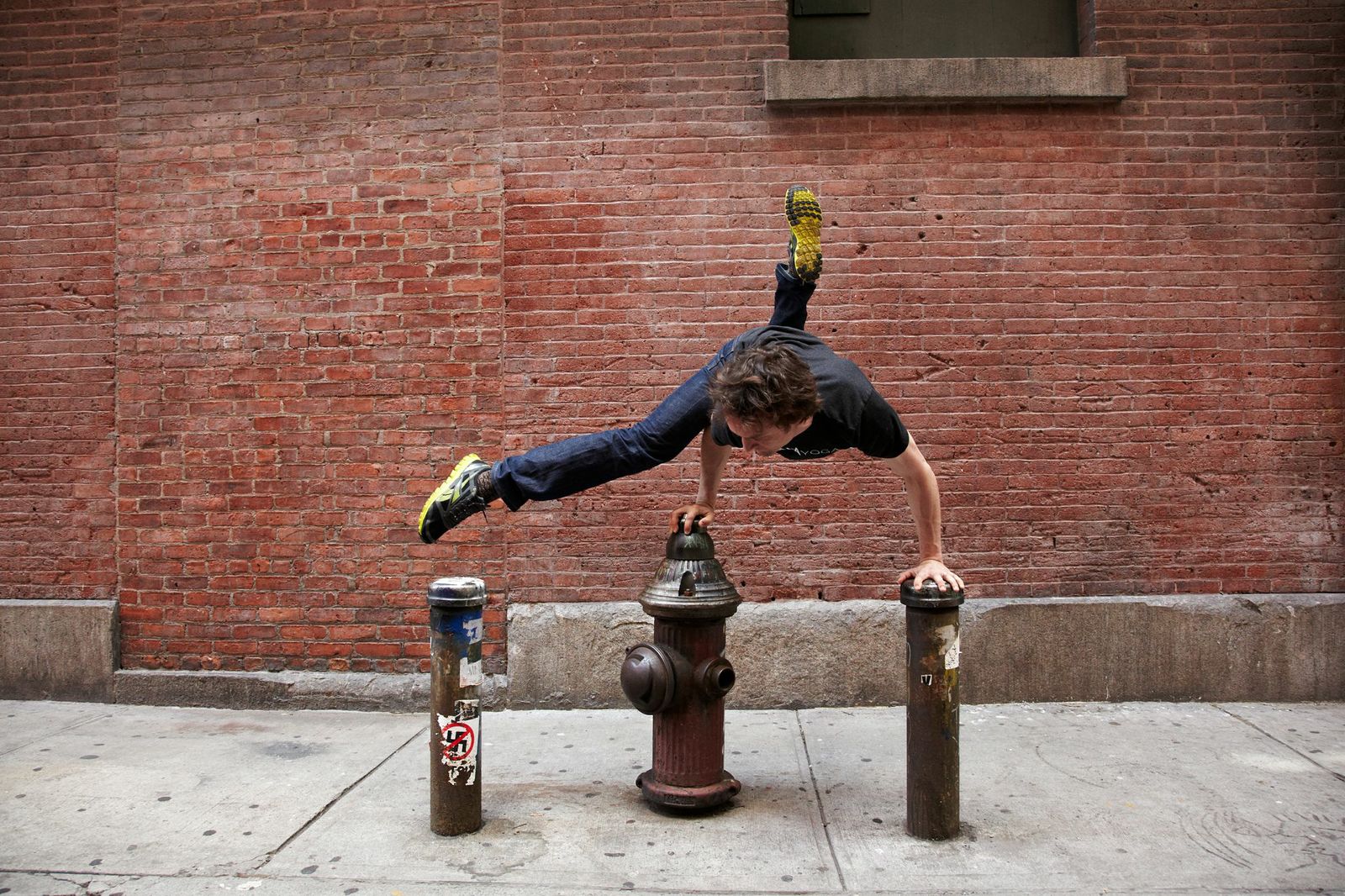 Mike in New York, doing hard things with ease. Photo via Strala Yoga. 