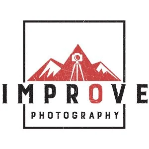 Logo for Improve Photography featuring stylized mountains with a camera on a tripod in front, and the words 'IMPROVE PHOTOGRAPHY' beneath.