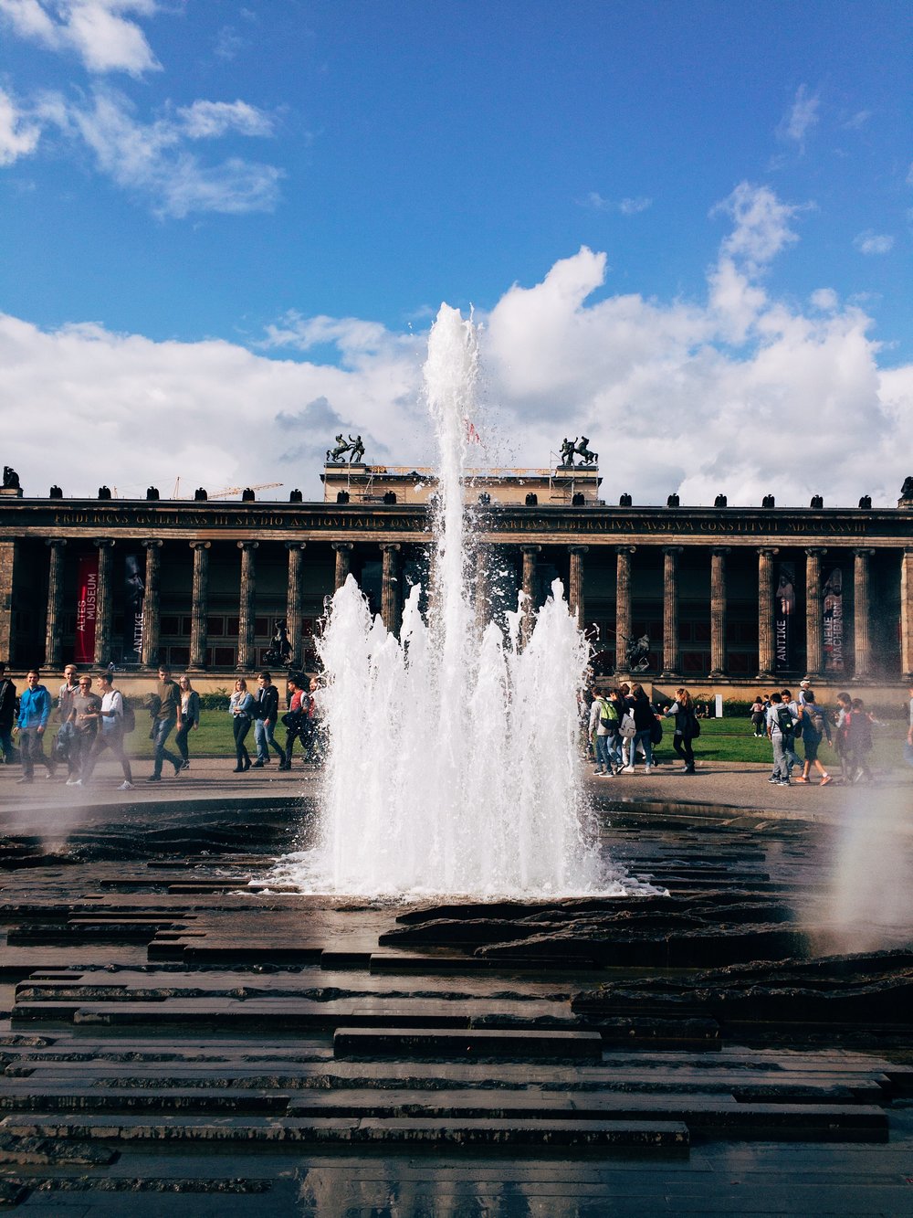fountain by berliner dom with altes museum in the background