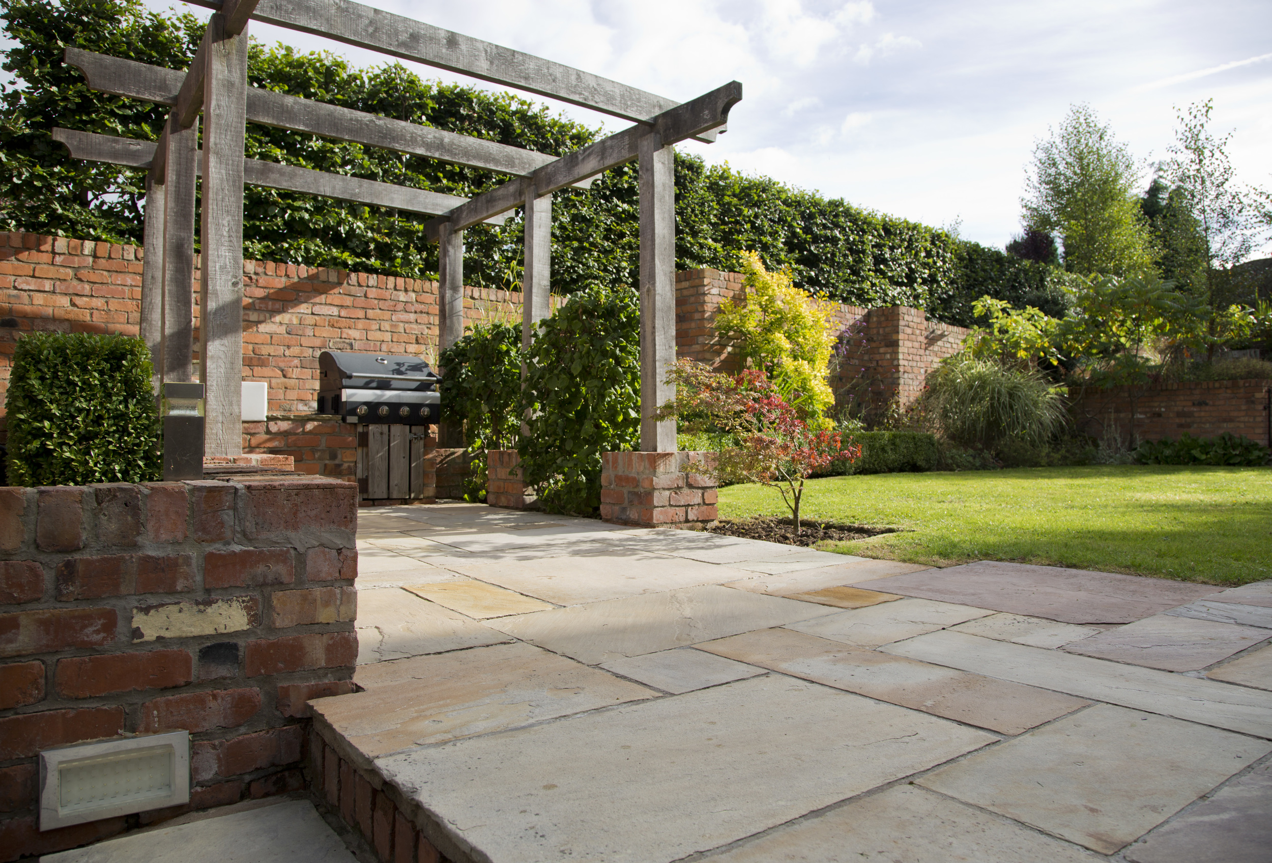 belfast landscaping and garden design with sandstone and oak pergola by peter dunn