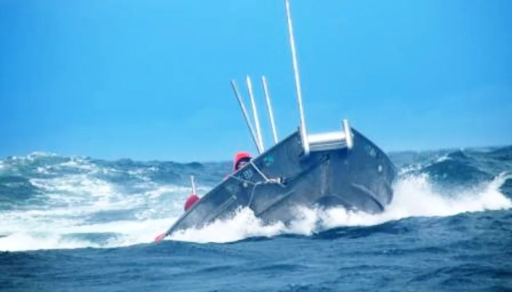 Skiff in waves--barely see people.jpeg