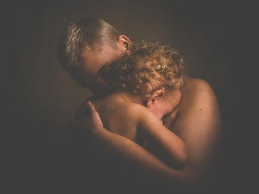 baby held by mother.jpeg