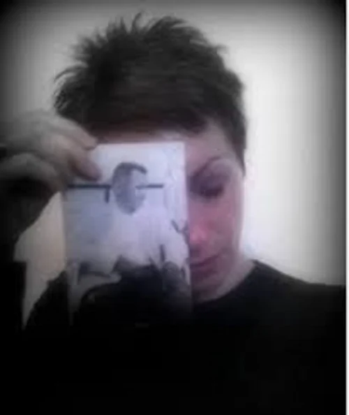 Leslie holding up dads photo.jpeg
