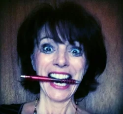 Leslie manic with pen in mouth.jpeg