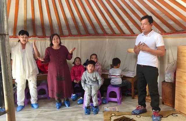 Mongolia--Batma + otehrs praying.jpeg