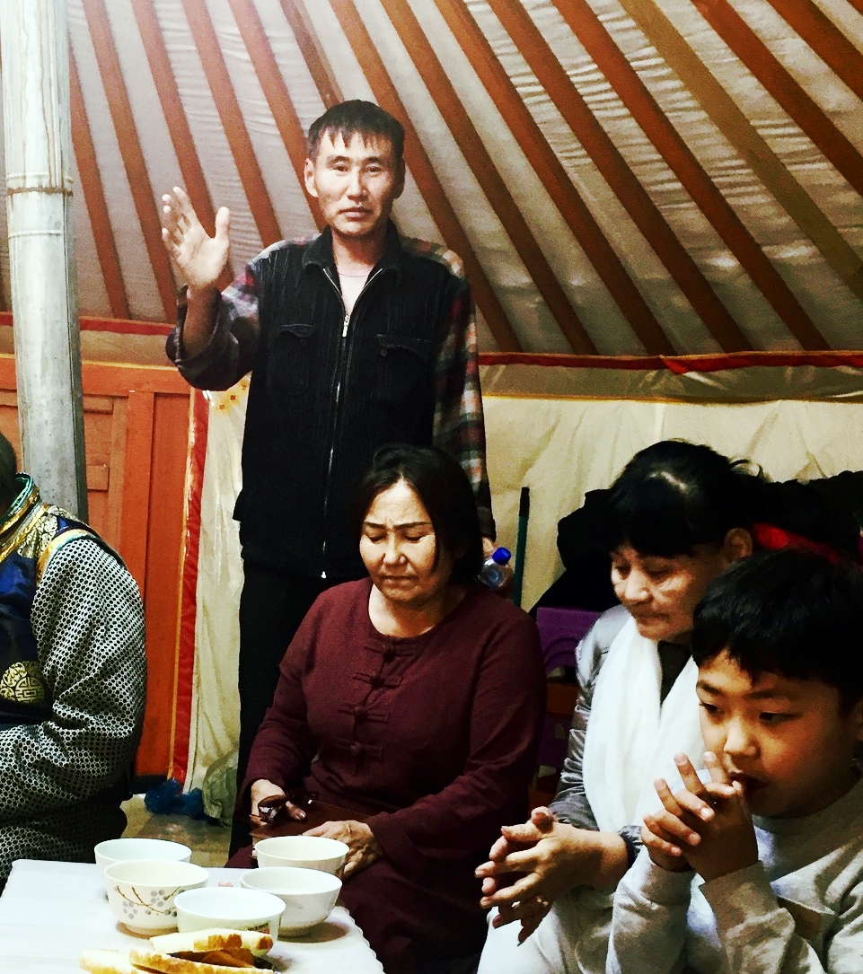 Mongolia--man praying with hand up.jpeg