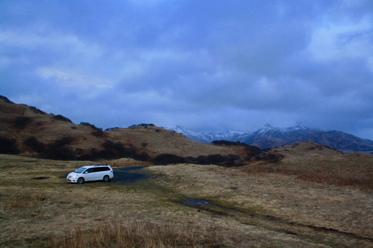 A-white van in tawny hillsides.jpg