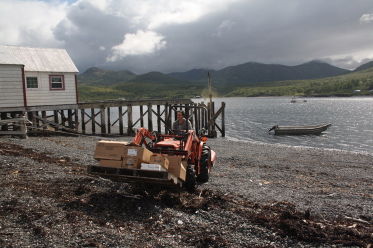 Blog-1st fishcamp--naph on tractor.png