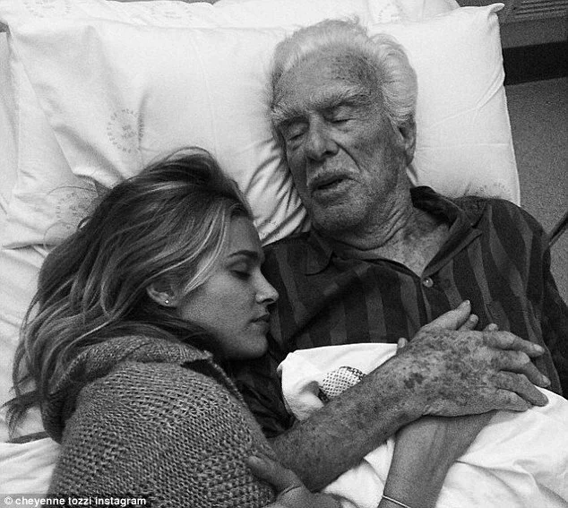 woman lying with sick father.jpg