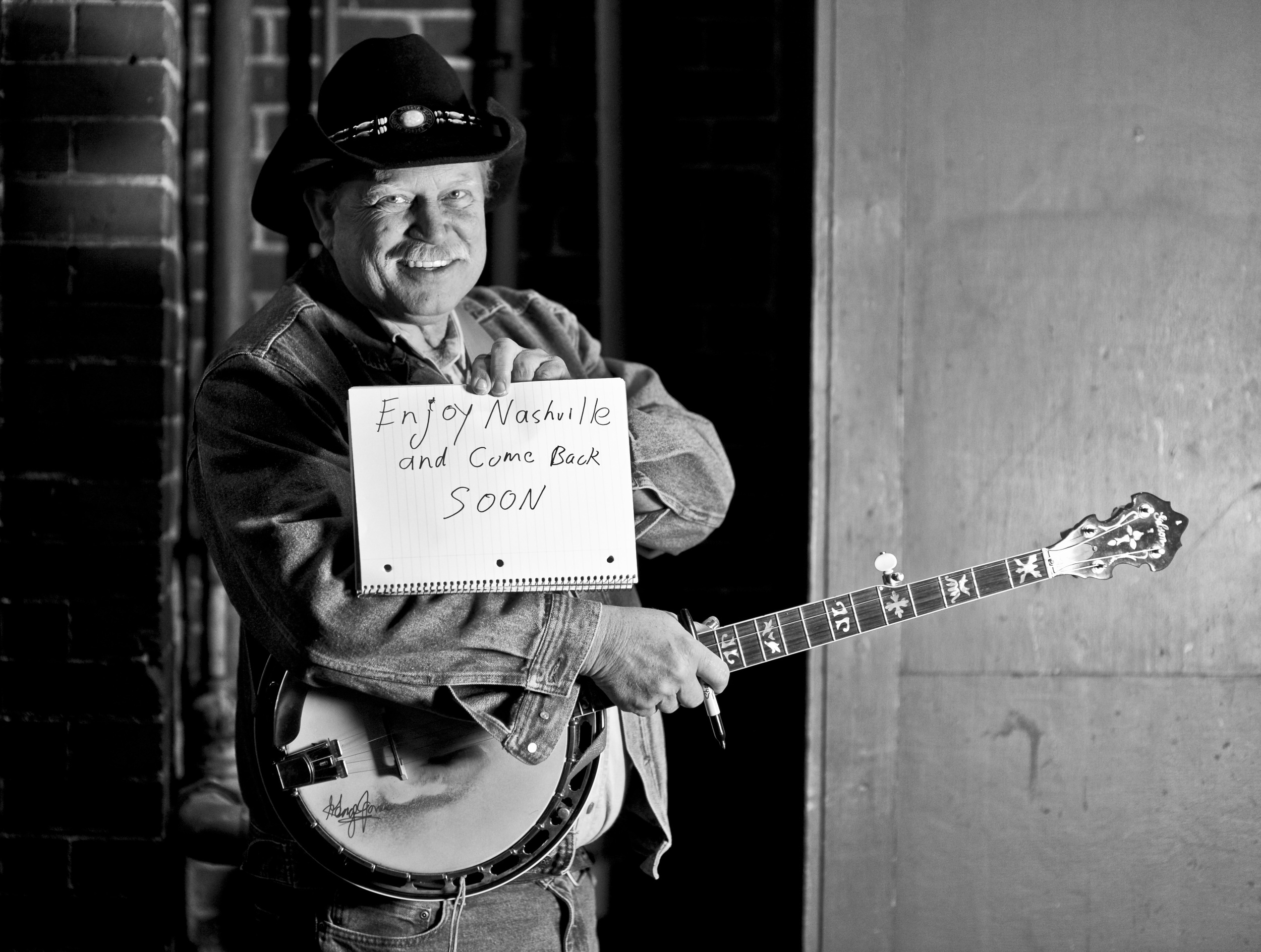 Kevin Coffey started playing his banjo around Nashville around six weeks ago, when he stopped working as a house refinisher. He enjoys playing on the sidewalks of Nashville much more, he said. “It’s a fun way to make a living.”
