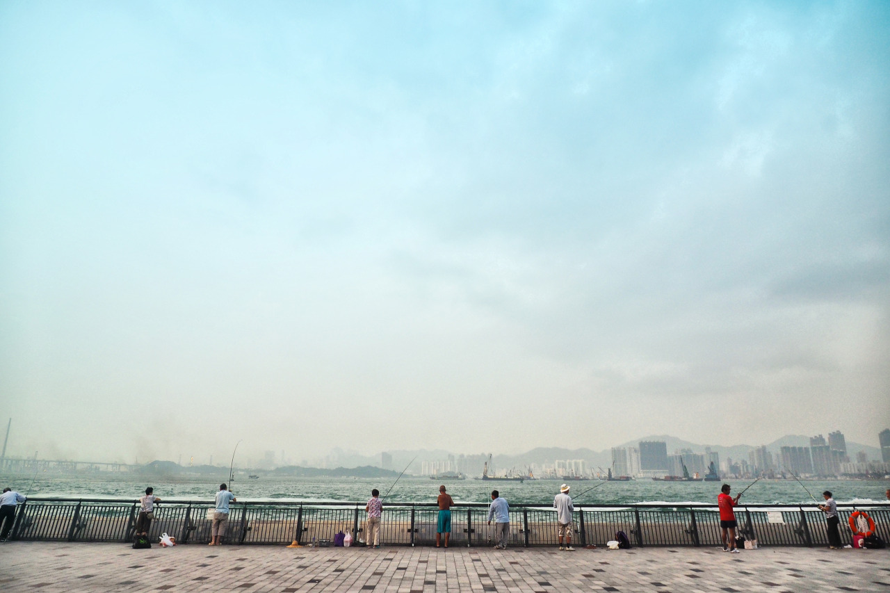 Fishing at Sun Yat Sen Memorial Park Promenade, Hong Kong . Olympus AU OM-D E-M1 + 12-40mm f/2.8