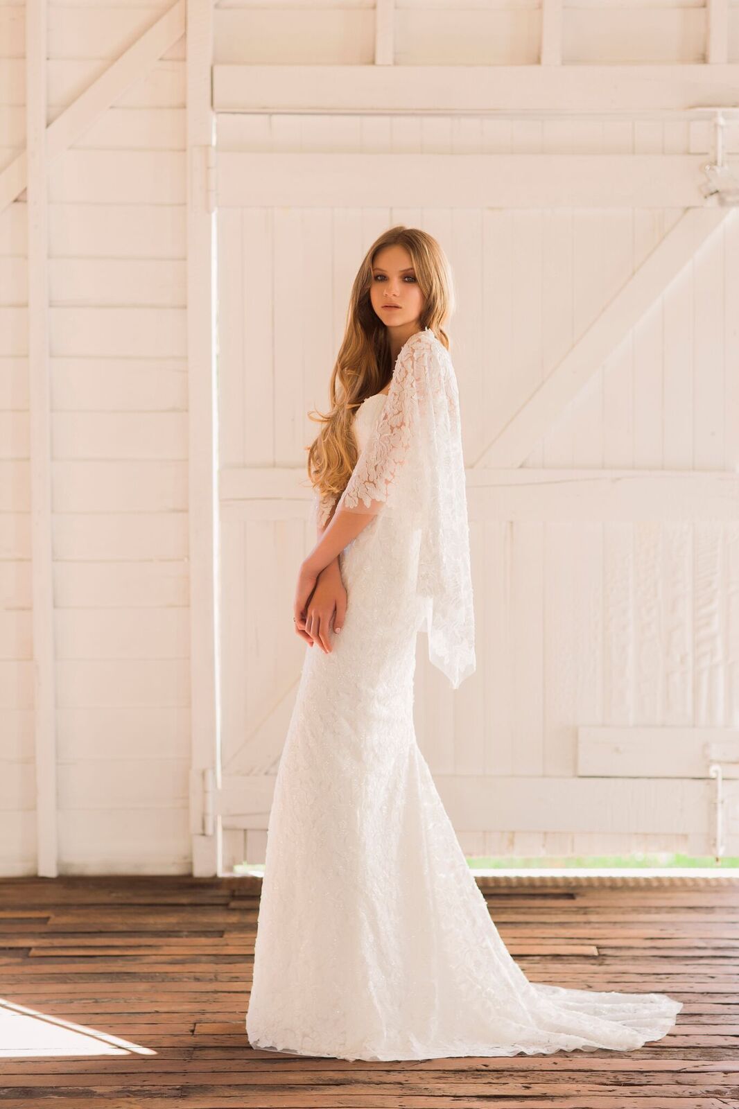 'Gwen' - strapless sheath gown with ivory embroidered tulle overlay long train and detachable cape.
