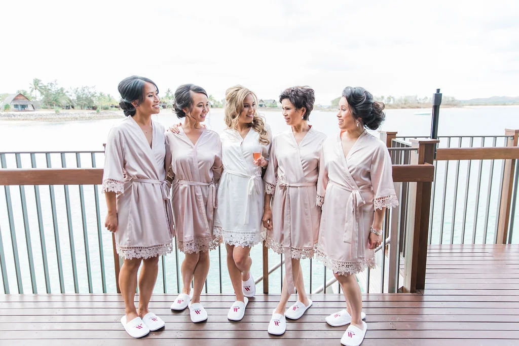 Mimi purchased satin robes from LeRose for herself, her bridesmaids, her sister and mother as well as personalised bottles of gin from Archie Rose Distilling Co.