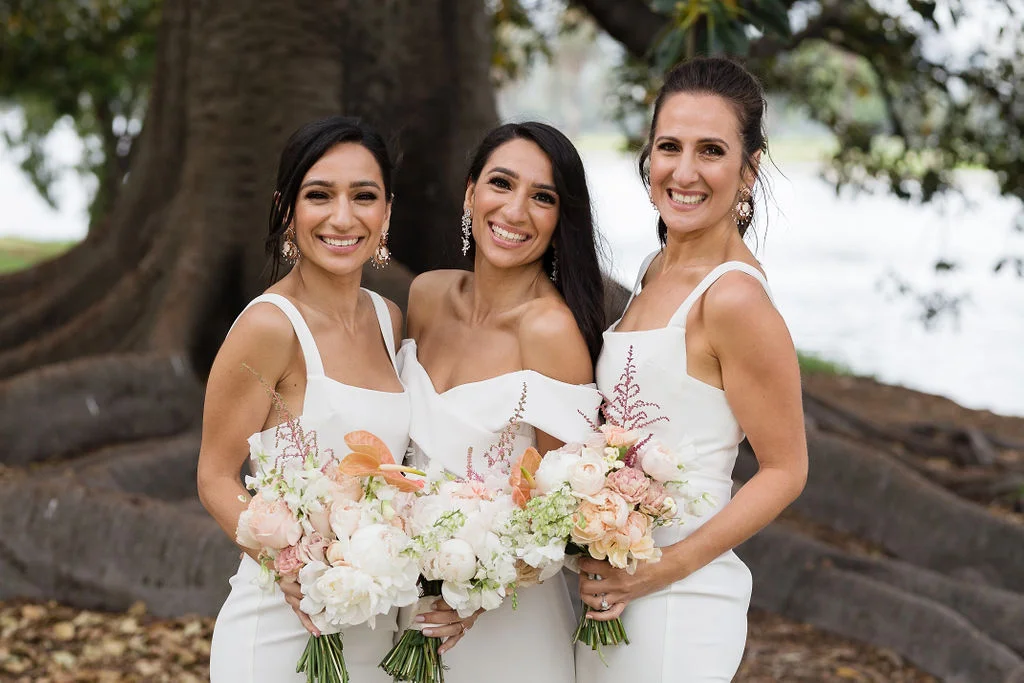 Stef’s bridesmaids looked gorgeous in their structured fitted crepe dresses by Alex Perry.