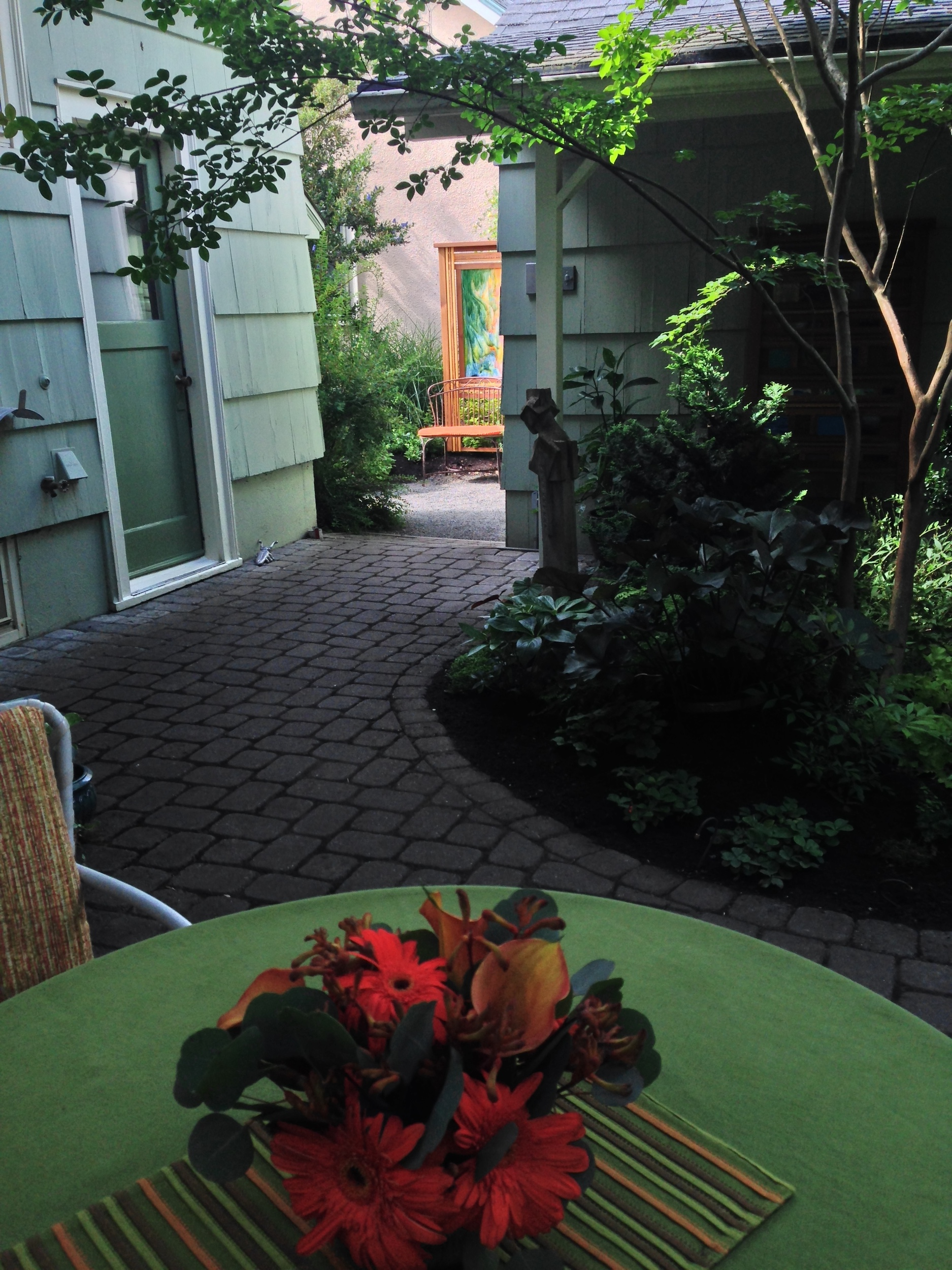 the setting sun at the end of a long day. this site line from the back yard living area, formerly a blank wall (at best), now glows with interest. 