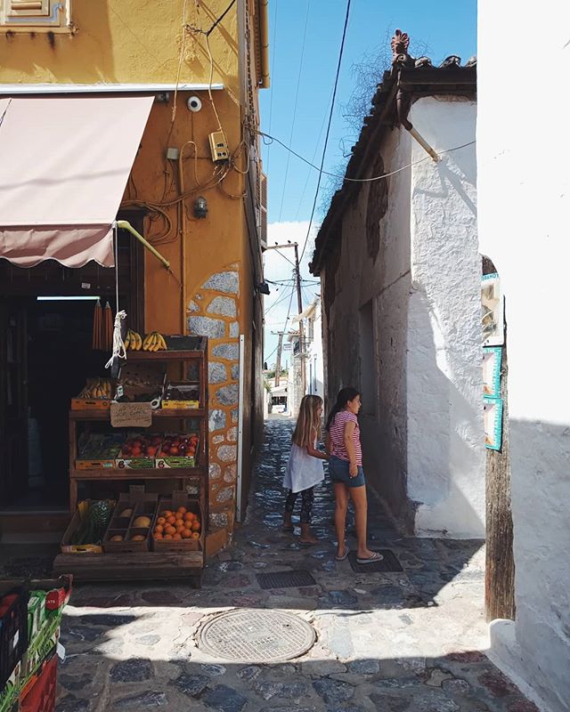 &quot;Yassas Kyria!&quot;&nbsp;⁣
⁣
As I was strolling around the streets of Hydra island, high above the busy port below, I came across these two little girls running through the alleys, greeting an old neighbor who was passing by.&nbsp;⁣
⁣
The girls