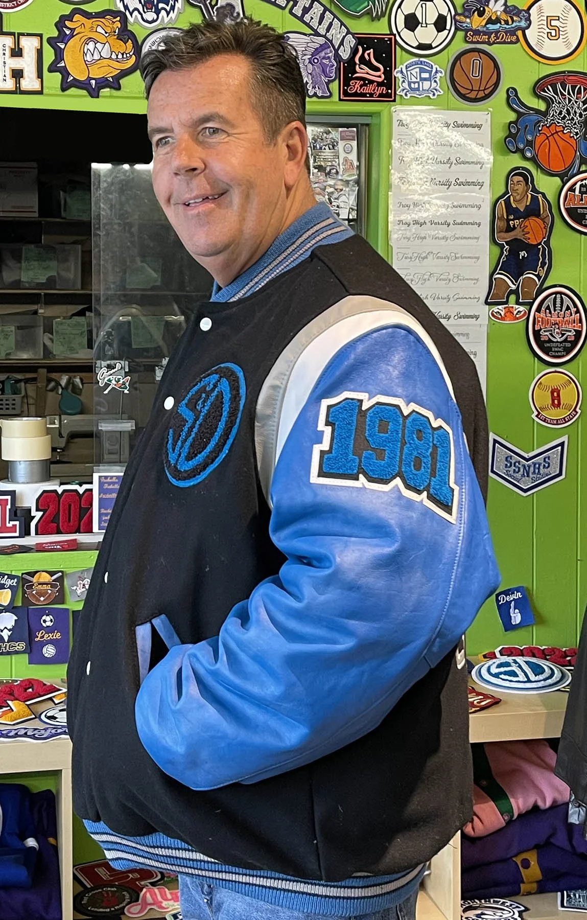 S&Dglobal-Sleeve-customvarsityjacketTurquoise-AvalonSkiesJacketArtist.jpg