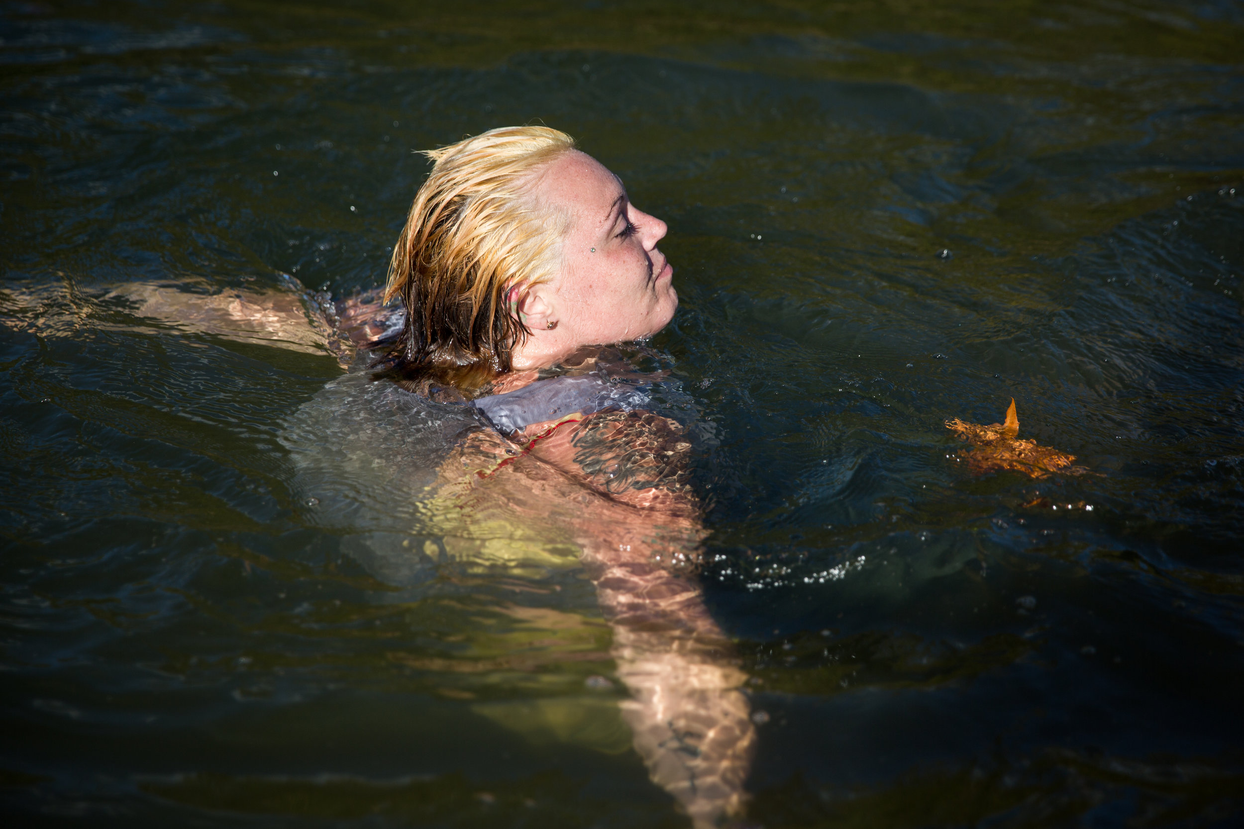  Whitney floats in the river after Jeremy's baptism. The river abuts Whitney's adoptive parents' property, and she often finds herself there when she needs to find peace or talk to God. 