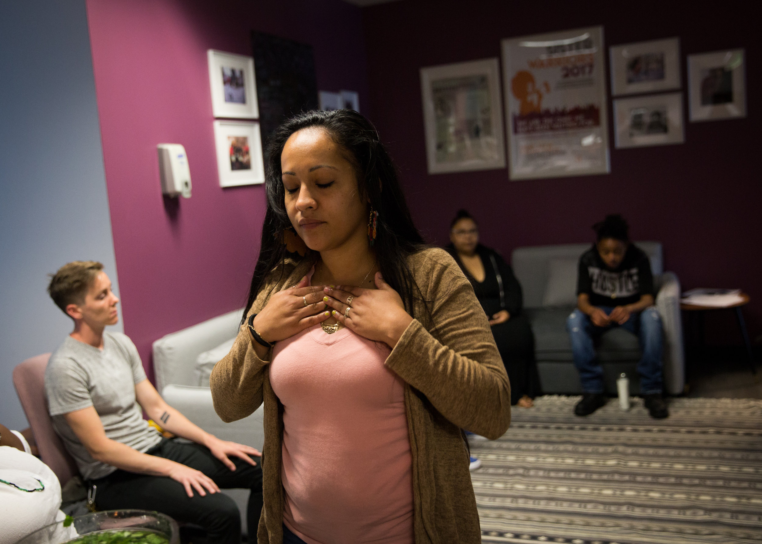  Julia Arroyo touches her chest with omiero, an herbal wash that is used for cleansing and blessing, during monthly ritual at the Young Women’s Freedom Center in San Francisco. The center was founded in 1993 and works primarily with young women and n