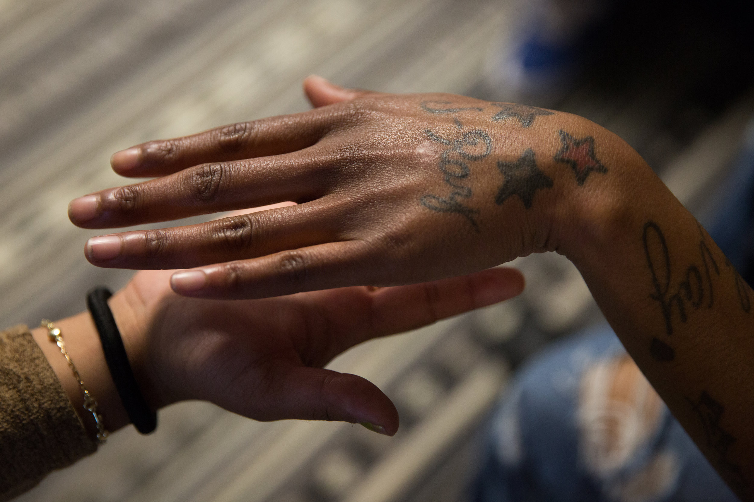  Vale Segi and Julia Arroyo hold their hands together during monthly ritual. "Throughout 25 years there's always a few things that young women say when they come. One is 'I don't get along with other girls,'" said Jessica Nolan, the executive directo