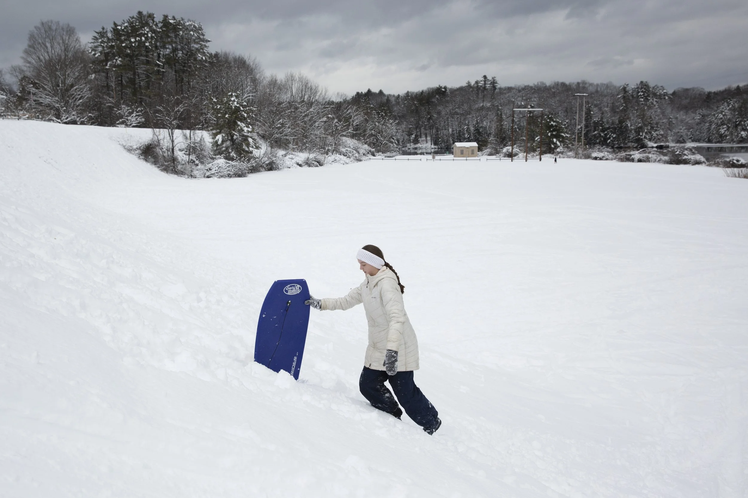  Gabby Gardner, 16, of Wilder, Vt., climbs back to the top of the hill while sledding with her brother Joey at Kilowatt Park in Wilder, Vt., on Tuesday, Jan. 24, 2023. The siblings had the day off from school because of an in-service day and used the