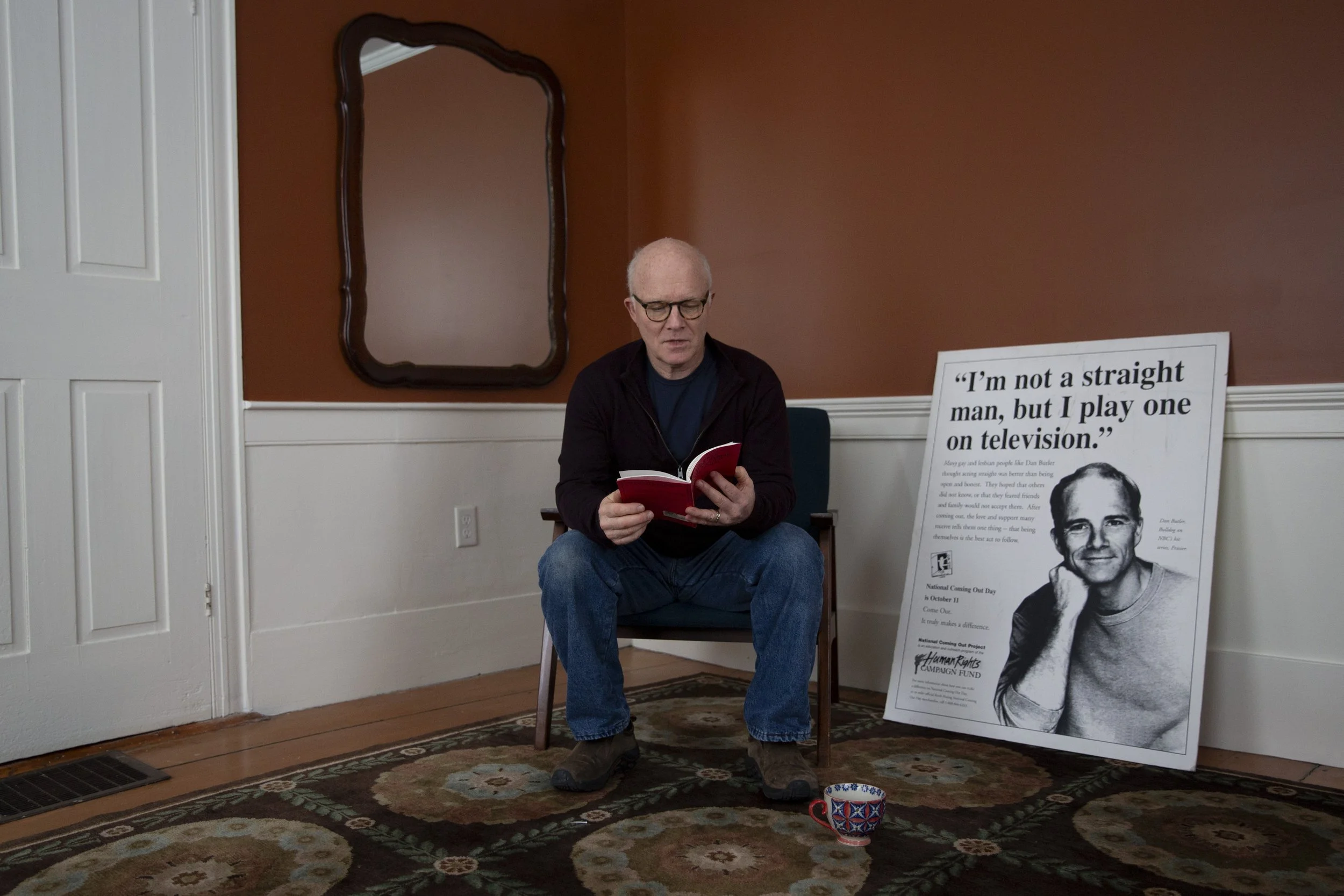  Dan Butler looks through a copy of his one-man play “The Only Thing Worse You Could Have Told Me” at his home in Newbury, Vt., on Wednesday, Dec. 6, 2023. The play, which premiered in 1994, is comprised of 10 vignettes that depict a spectrum of gay 