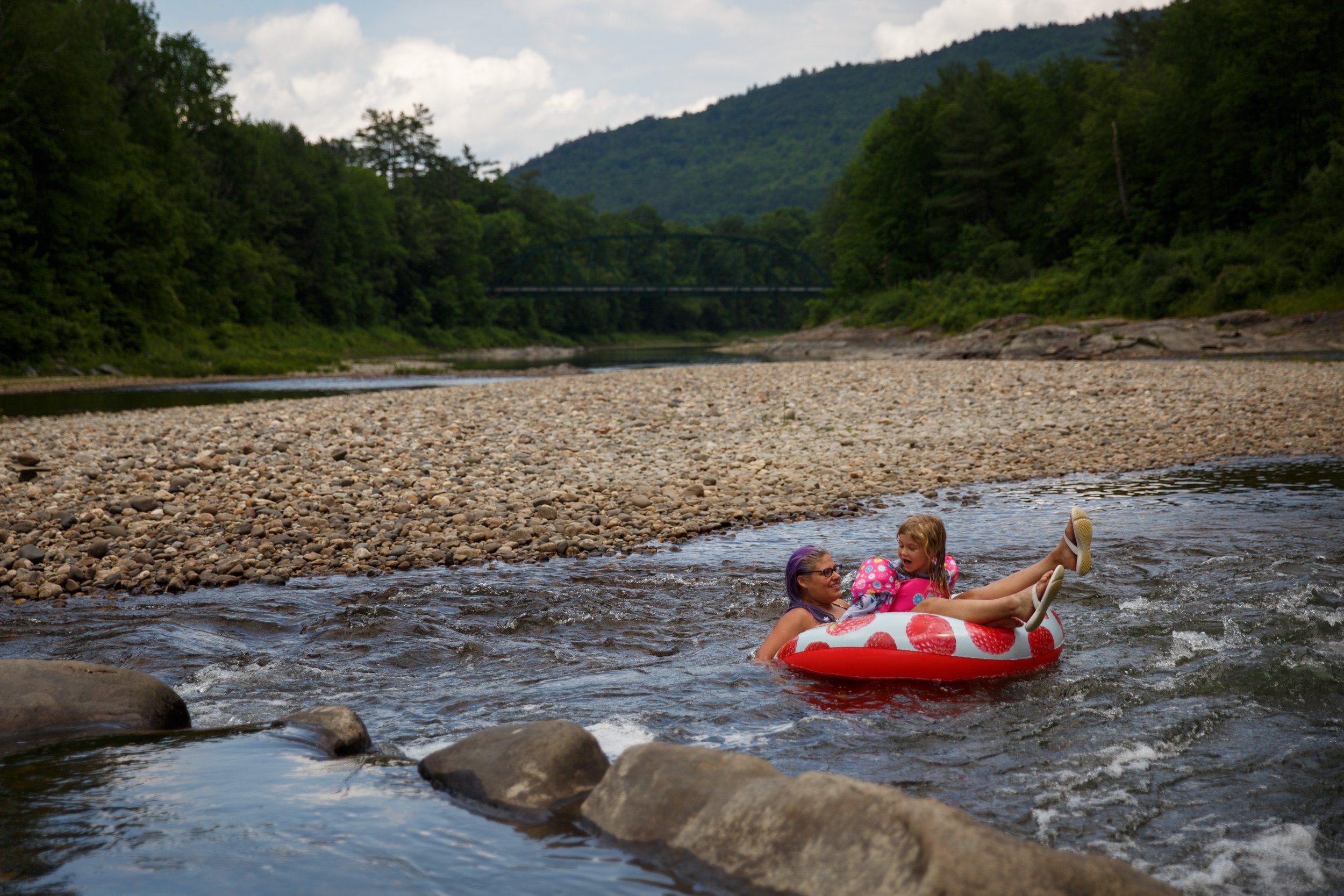  Kate Ripley, of Chelsea, Vt., and her daughter Ella Bjorkman, 5, float down a small rapid on an inner tube in the White River in Sharon, Vt., on Monday, June 28, 2021. Ripley's boyfriend got off of work early due to the heat, so she and Bjorkman pic