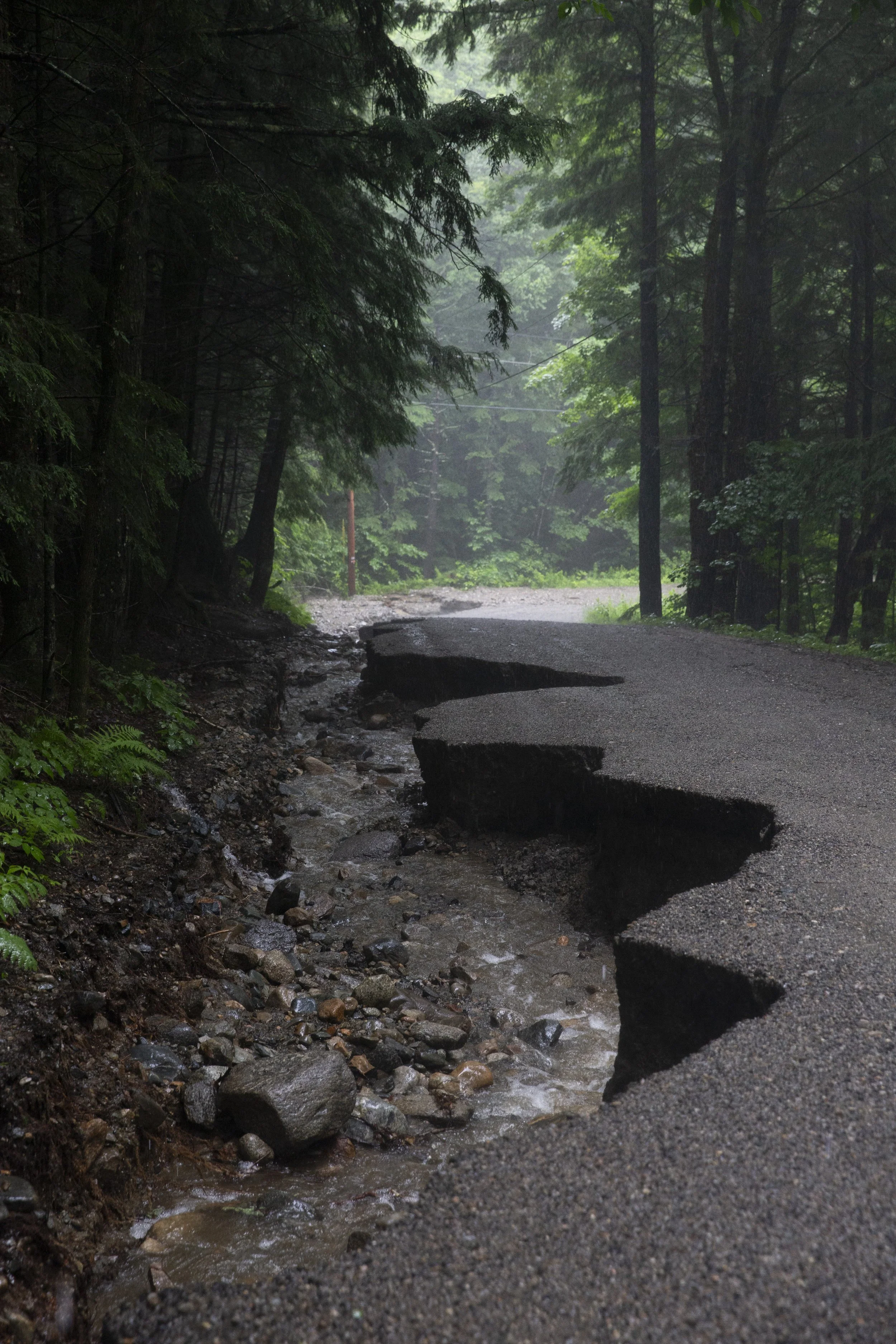  Flood damage caused by heavy rain is visible on South Road in Canaan, N.H., on Monday, July 10, 2023. Bob Barrett, who has lived on the road for six years, said this is the worst he’s ever seen it. “This is mind-blowing, it really is,” he said of ho