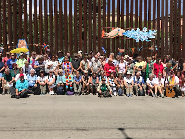 entire group at border wall - by ucc.jpg