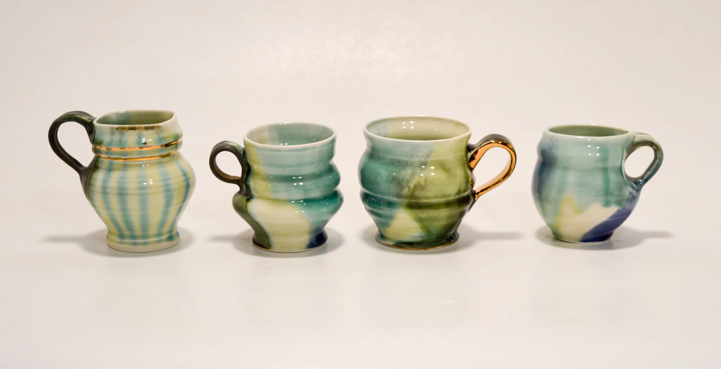 2015, Porcelain, Polychrome glaze ^6, Gold luster ^018, 4.5" x 3.5", 3.5" x 3.5", 4" x 4", 3.5" x 3"