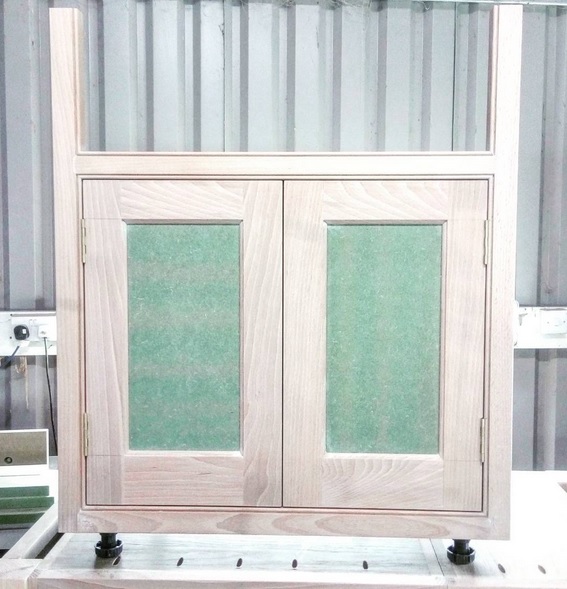 Here we can see a butler sink unit prior to painting. This unit's framework and doors are made from extremely hard wearing European beech, a fantastic choice for this style of cabinetry. The delicate bead detail around the door opening and sink aperture is crisp and sharp, and, being dense and durable, should look good for decades to come.