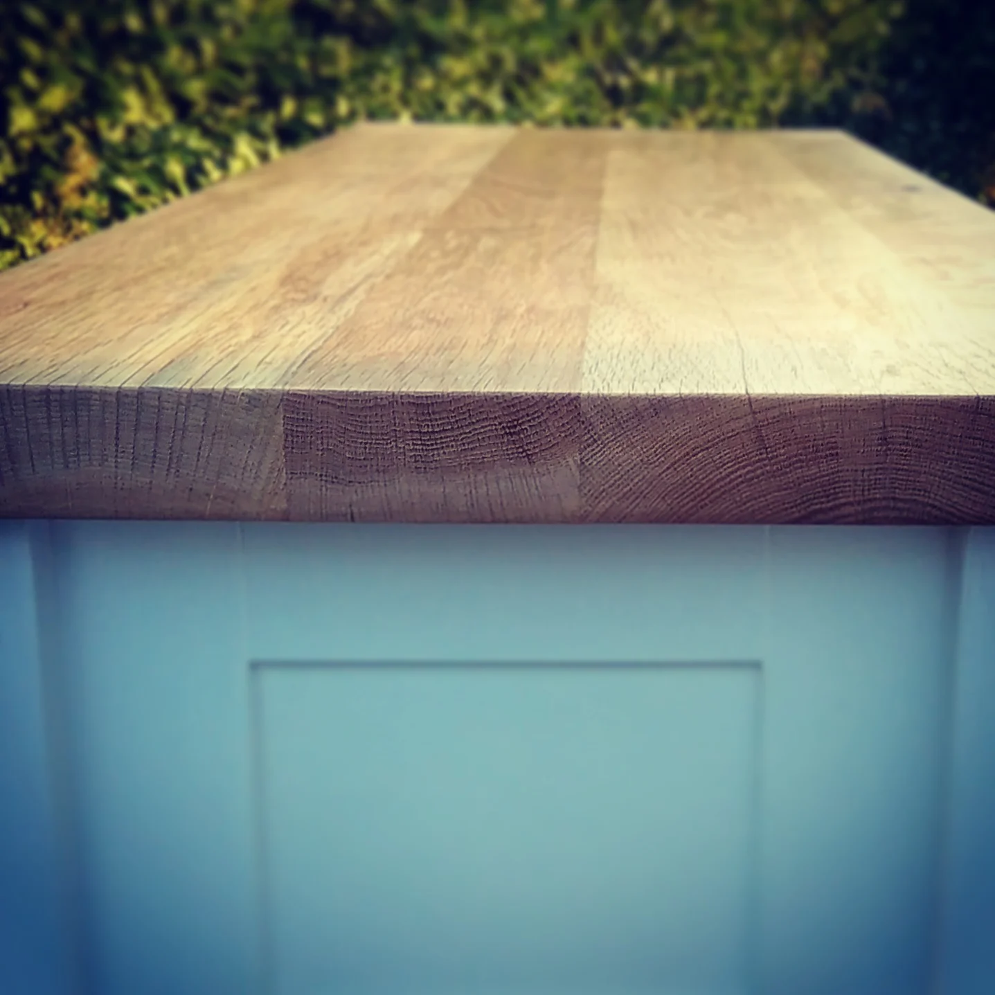 One of our wide plank reclaimed oak worktops, being used here as part of a freestanding kitchen for the scullery table. 