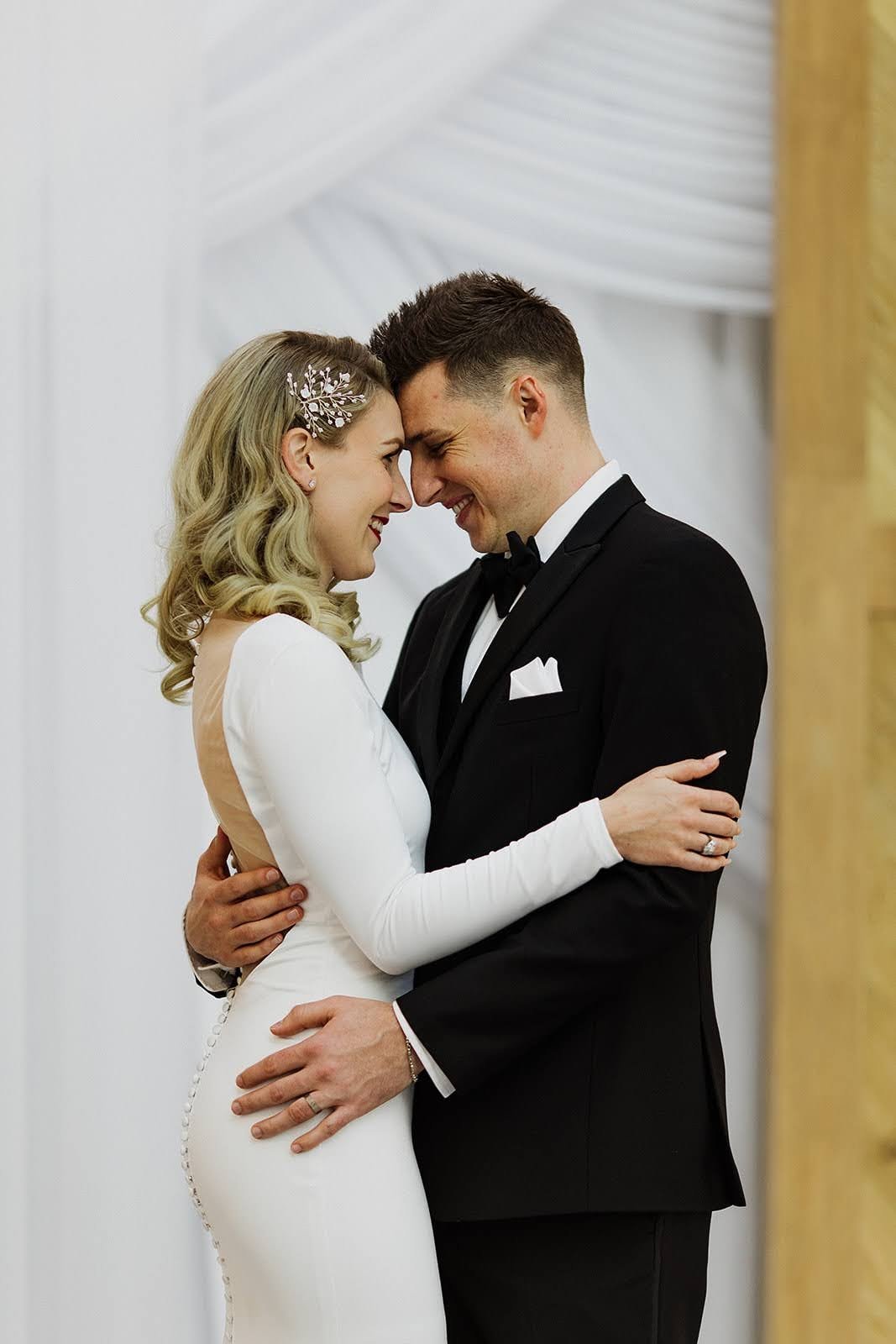 ride and groom embracing in a wedding portrait for Krystal S.'s Just Lago love note.