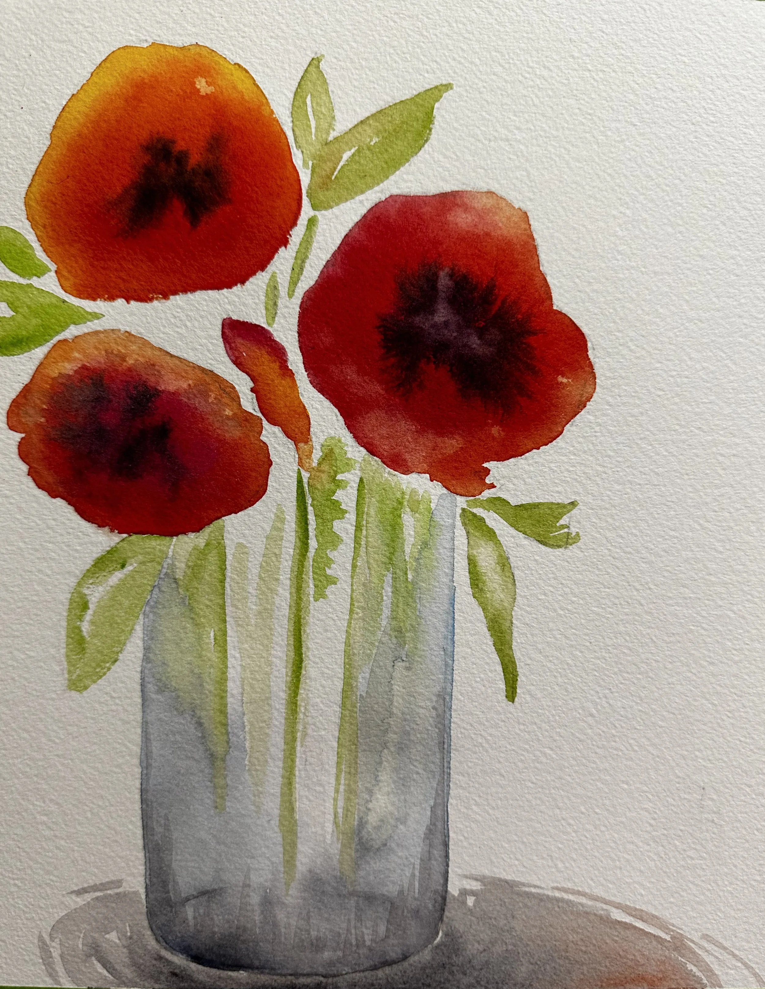 Watercolor painting of three red poppies in a gray vase with green leaves.