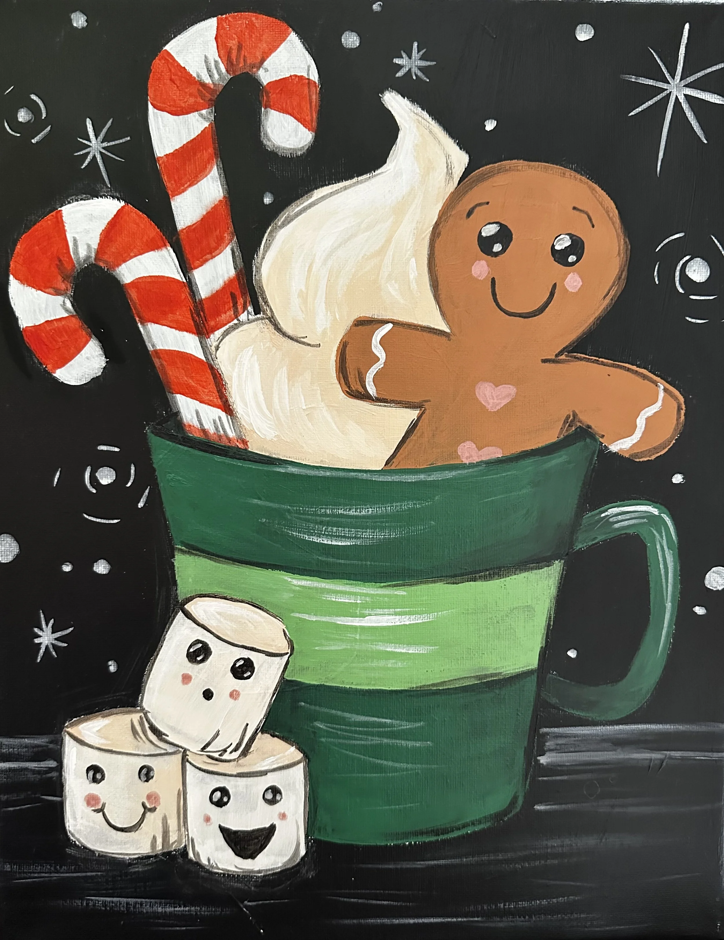A festive Christmas-themed painting of a green mug filled with a gingerbread cookie, two candy canes, and marshmallows with smiling faces. The background is black with white snowflakes and stars.