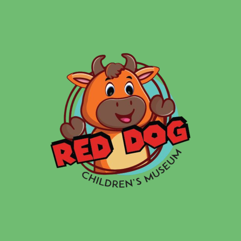 Logo for the Red Dog Children's Museum featuring a cartoon red dog with big eyes, smiling, with a rainbow in the background and the text 'Red Dog Children's Museum'.