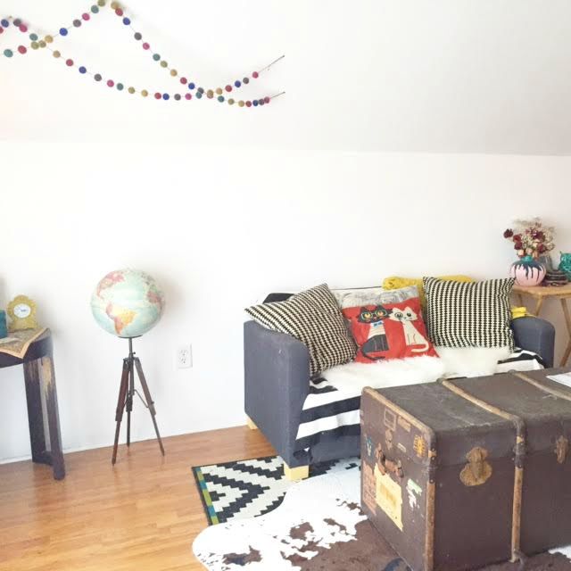 Our living room has taken on many layouts and we've re-arranged countless times before deciding on this current look! Our small Ikea sleeper sofa has been a lifesaver both in terms of fitting up our very narrow stairs to semi-comfortably hosting overnight guests! The coffee table is a vintage trunk that my sister and I found at a local flea market at the corner of Elmwood and West Ferry and the globe was thrifted! Most accessories come from garage sales, family, Ikea, and cb2.