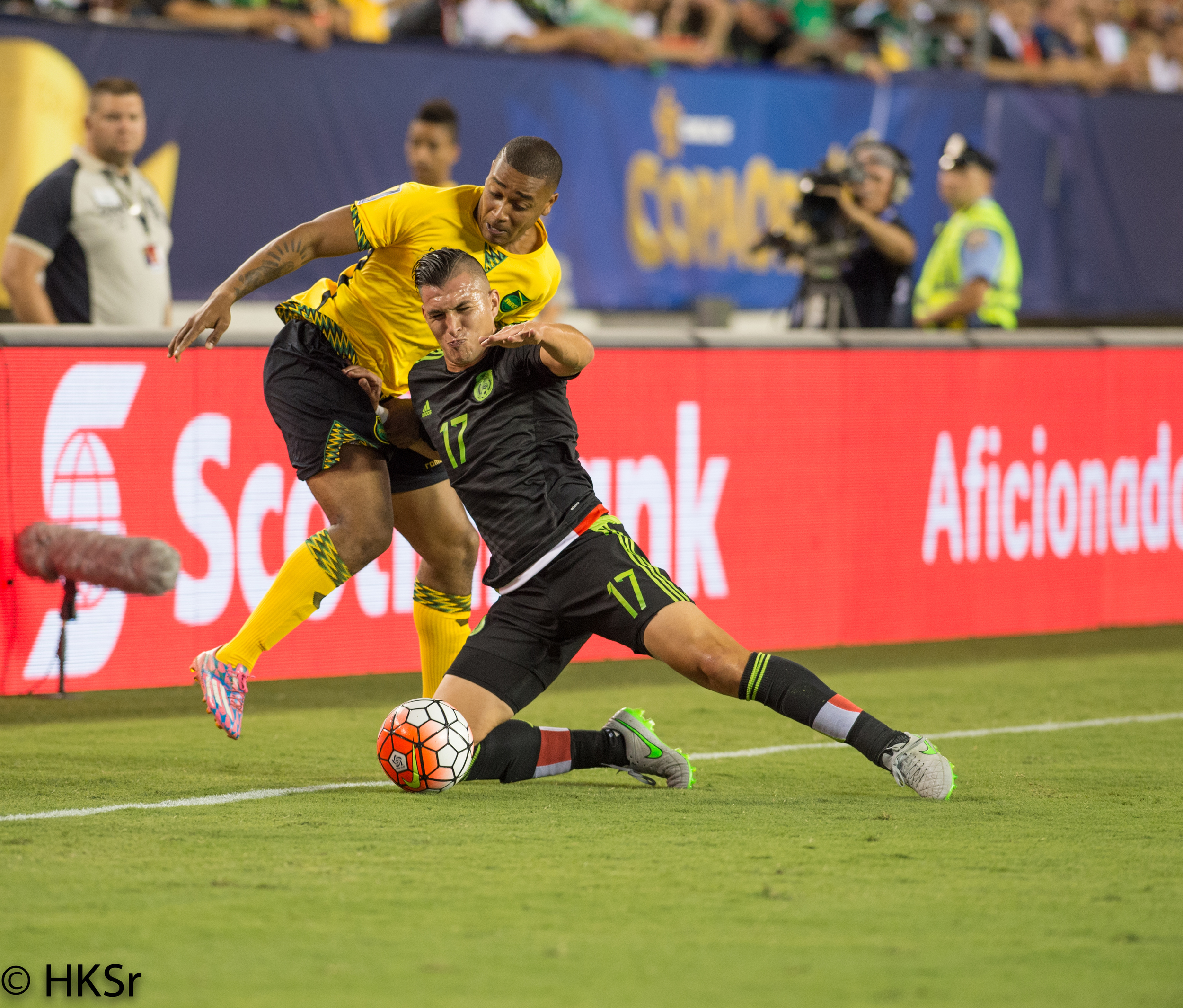 Mexico player #17 Jorge Torres Nilo fights off Jamaica player#2 Christopher Humphrey for ball position.