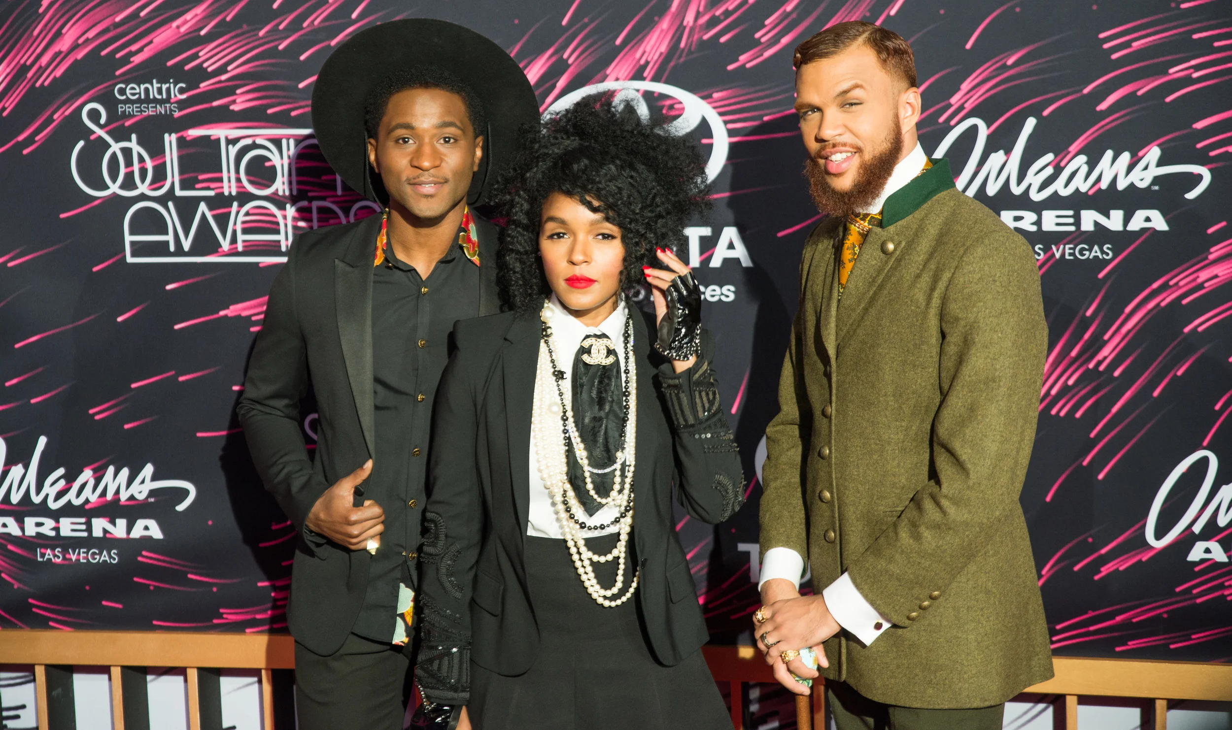 Roman GianArthur Janelle Monae and Jidenna pose for a photo on the red carpet at the Soul Train Awards