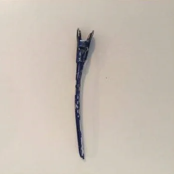Hair is secured by sectioning clips that can be bought at your local beauty store or online.