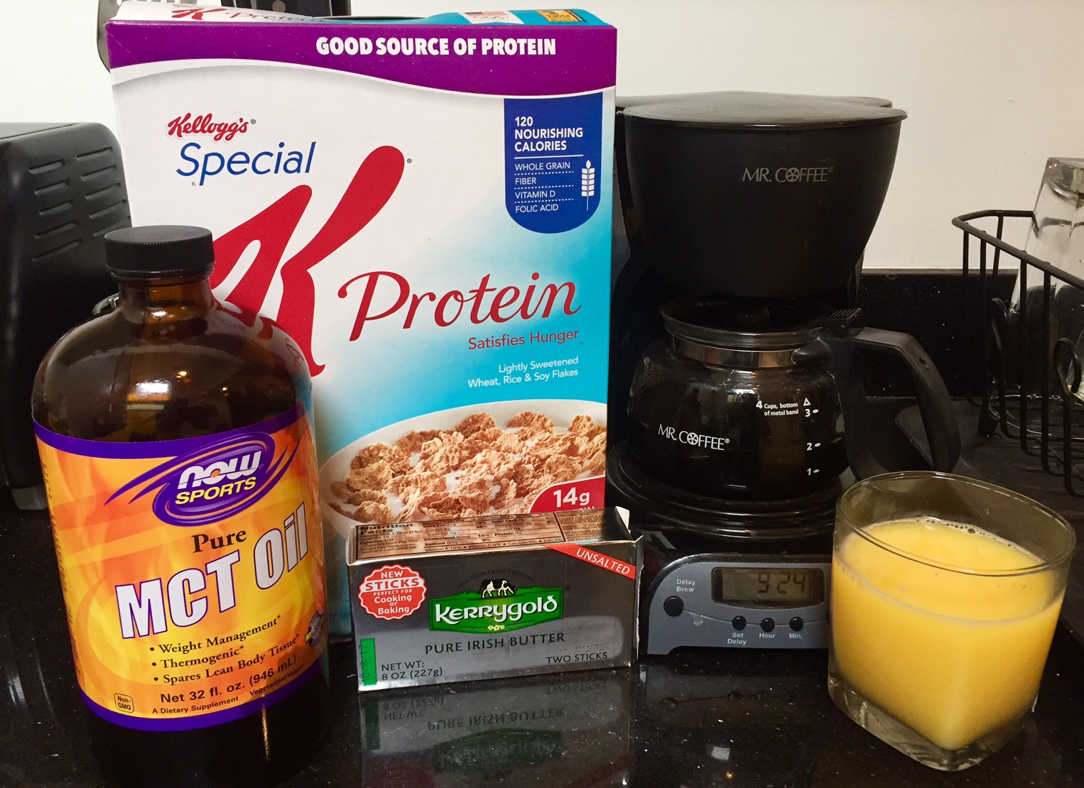 Breakfast: Special K Protein, Orange Juice, and the essential ingredients for Bulletproof Coffee