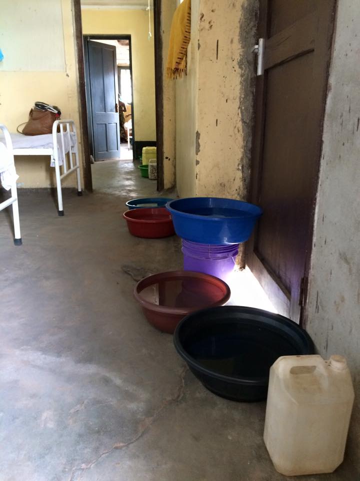 Bowls of water line the wall in a maternity waiting home, where women can spend days awaiting delivery rather than trying to travel hours over rutted roads to the hospital when they're in labour. There is no running water in the building, and the women sometimes sleep two to a bed due to overcrowding. (Laura Payton)