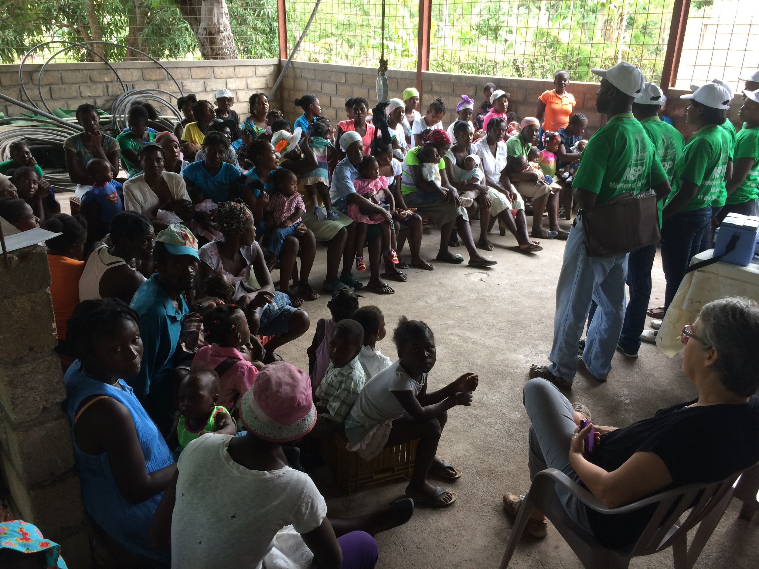 Community health workers discuss vaccination and nutrition with women in Terre Neuve, Haiti. (Laura Payton)
