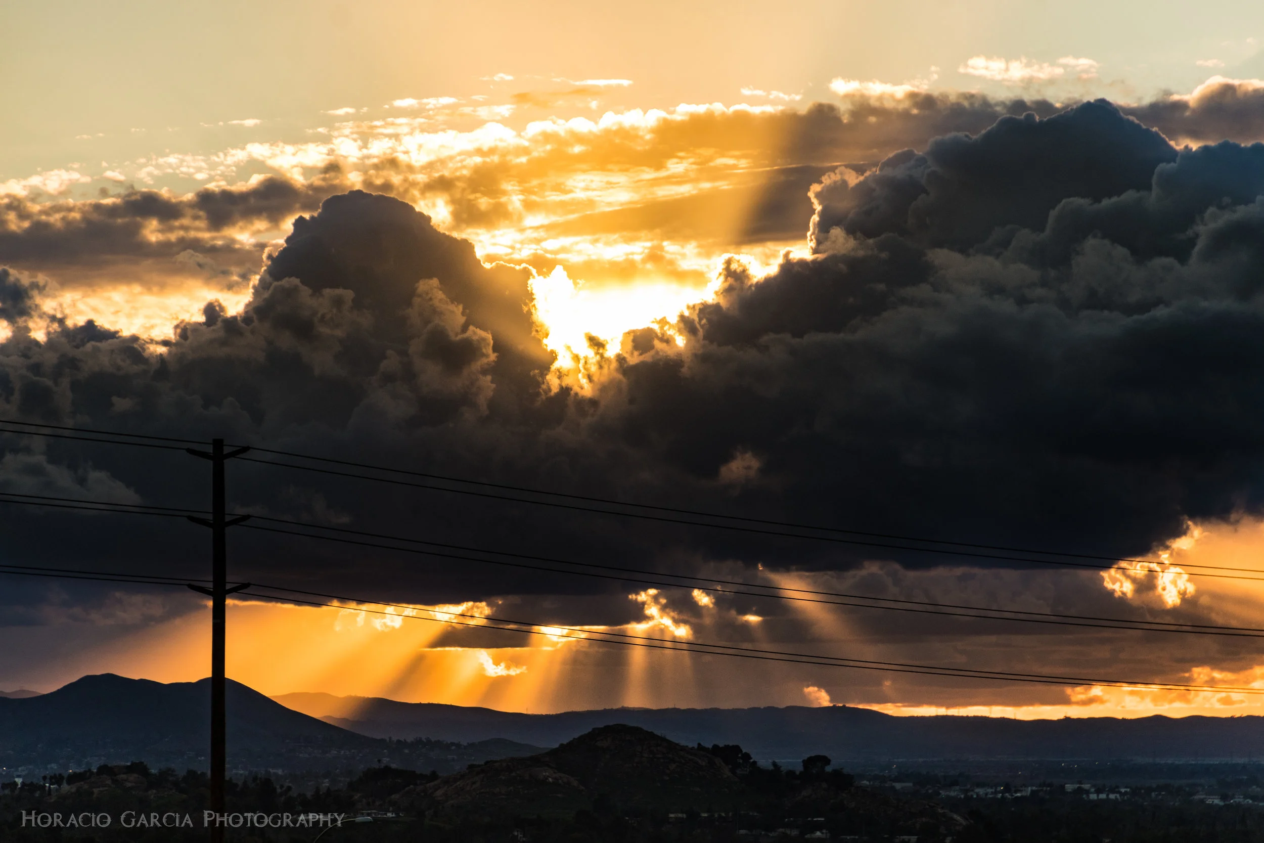 Sun rays blasting through clouds in Riverside, CA.