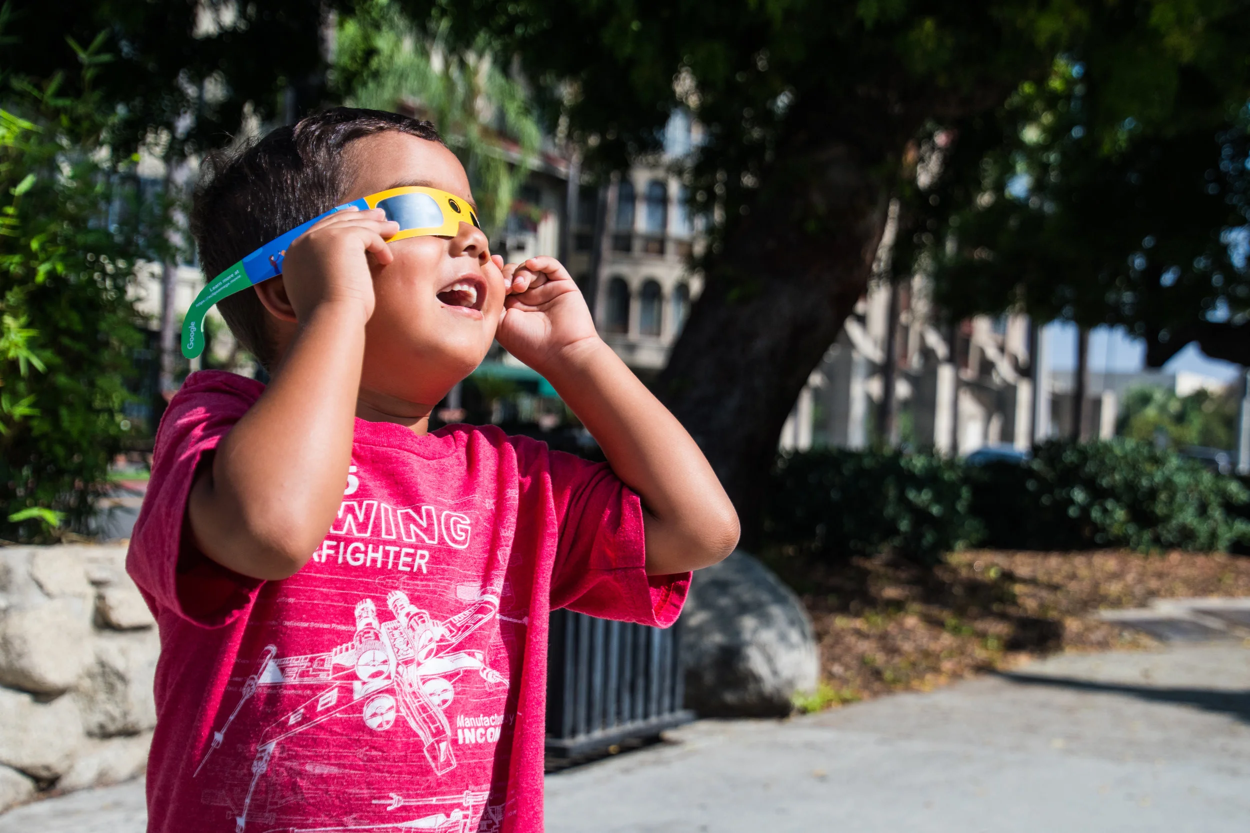 "Can You Take A Picture of Me!?" Johnny looks up and enjoys the moon getting in front of the Sun during the Solar Eclipse, visible from most parts in the United States, on August 21, 2017.