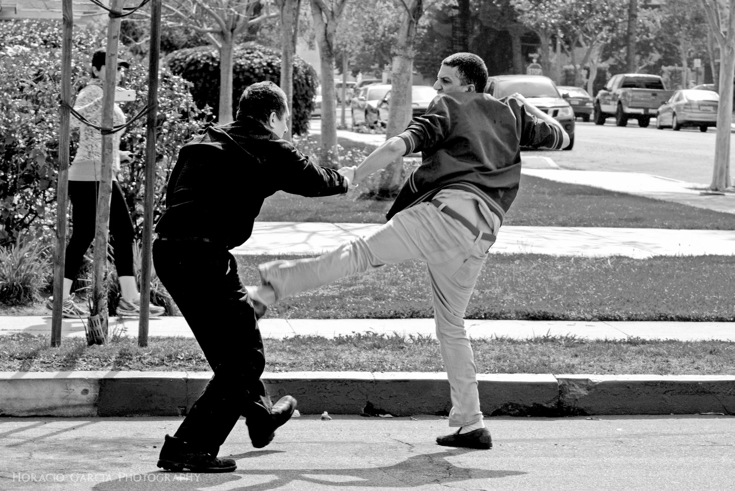A KKK member (left) and a protester duke it out in the streets as the KKK Rally gets out of control. The protester ended up with multiple stab wounds.