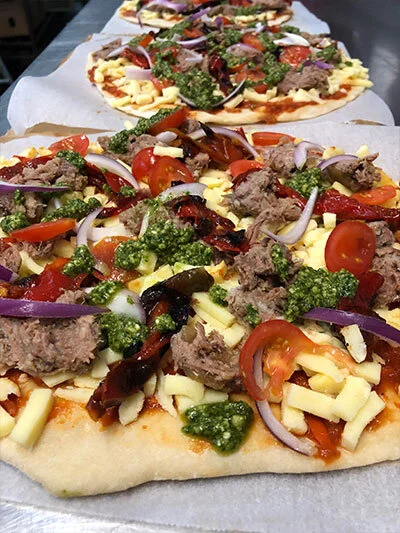 Gourmet pizzas made fresh in-house